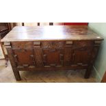 A late 18th Century carved oak coffer