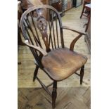 A 19th Century elm seat wheelback chair