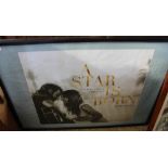 A framed and glazed print of film poster for 'A Star is Born'