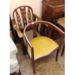 A 1920's reclining mahogany armchair and a inlaid mahogany tub chair