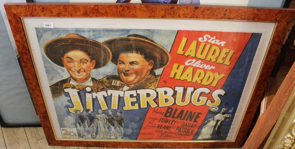 A maple framed and glazed print of film poster for Laurel and Hardy in Jitterbugs