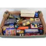 A box of die cast plus two boxed Scalextric models