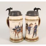 A pair of 'Mettlach' steins with white metal lids bearing military stand of arms and eagles,