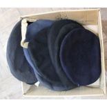 A box of hats and berets including military examples