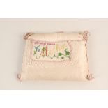 A WWI era needlework cushion containing silk cards etc