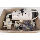 A box of Star Wars figures and vehicles