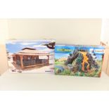 Boxed Schleich dinosaurs and log cabin