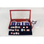 A display case containing metal replicas of the worlds most valuable stamps