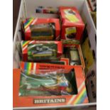 Twelve various boxed Britains agricultural vehicles and two trucks