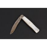 A pen knife with mother of pearl scales and silver blade,