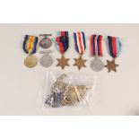 Two WWI medals with five WWII medals and a quantity of badges and insignia