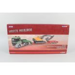 A boxed Corgi heavy haulage Mercedes Benz Actros Nooteboom low loader and Volvo excavator EC210