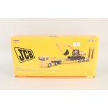 A boxed Corgi ERF E C Nooteboom step frame trailer and JCS JS220 excavator