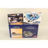 A radio control helicopter and two model kits