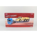 A boxed Corgi heavy haulage DAF XF Super Space Cab Nooteboom step frame trailer and Volvo