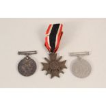 A WWI 'War medal' with a WWII 'War medal' plus a German War Merit Cross with swords