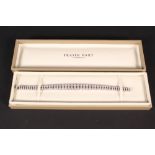 An 18ct white gold double line diamond bracelet comprising of ninety four graduating diamonds,