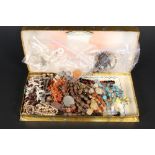 A box of various costume jewellery mainly bead necklaces plus a pair of silver foliate engraved