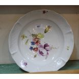 A 19th Century German porcelain dished plated with relief moulded rim sections and floral painting,