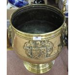 A heavy 19th Century brass jardiniere/wine cooler with embossed Coat of Arms,