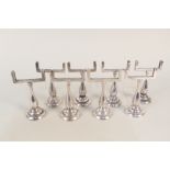 A set of eight Elkington silver plated menu holders