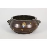 A Chinese bronze bowl with animal mask and gold splash decoration,