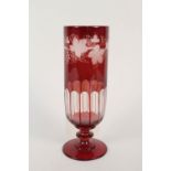 A Victorian red flashed glass vase with vine leaf decoration,