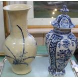 A 19th Century Dutch Delft bird and floral lidded vase plus one other vase