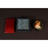 A gilt metal red enamel decorated card case plus two papier mache boxes with painted decoration