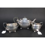 A silver three piece tea set by S.