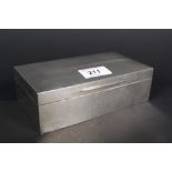 An engine turned silver cigarette box with engraved initials to top and inscription to front,