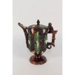 A 19th Century Whieldon style display jug with relief mask and leaf decoration,