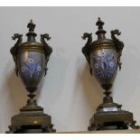 A pair of gilt metal garniture urns with blue floral decoration