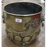 A 19th Century brass jardiniere with embossed cornucopia, gadrooning and lion mask ring handles,