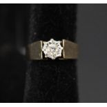 A large 9ct gold ring with small illusion set diamond,