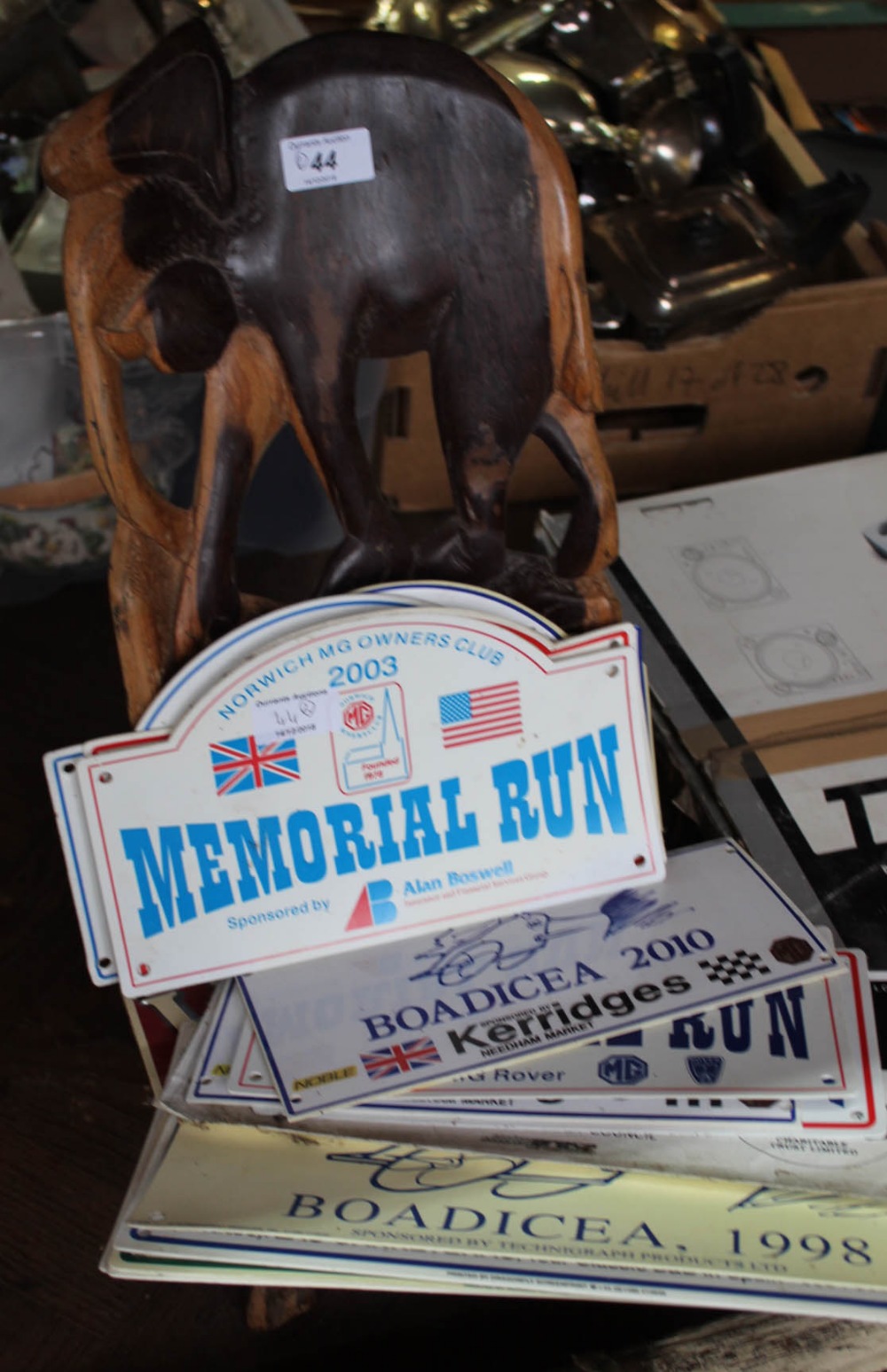 An African hardwood childs chair with elephant carving plus various motor rally plaques etc