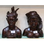 A pair of Indonesian hardwood male and female busts