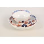 A Lowestoft tea bowl and saucer with dolls house pattern,