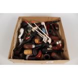 A collection of pipes to include German porcelain, Meerschaum,