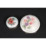 An enamelled silver compact with floral decoration and an enamelled silver lidded pill pot with