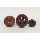 Three wooden fishing reels