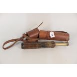 A leather cased brass four draw telescope
