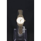 A 9ct gold lady's Omega watch on 9ct gold strap