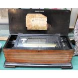 A rosewood cased music box with drum and pipe inlays playing 8 airs
