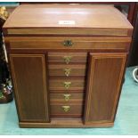 An inlaid mahogany Wellington style jewellery cabinet