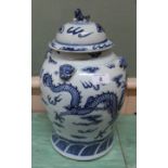 A 19th Century Chinese blue and white lidded jar with dragon decoration,