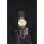 A lady's 9ct gold wristwatch on 9ct gold 'bricklink' strap