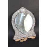 A very large silver fronted mirror,