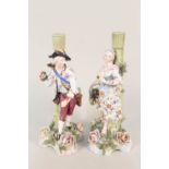 A pair of 19th Century Sitzendorf figural candlesticks,