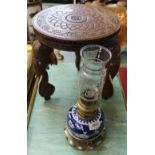 An Indian carved wooden stool on elephant supports plus an oil lamp